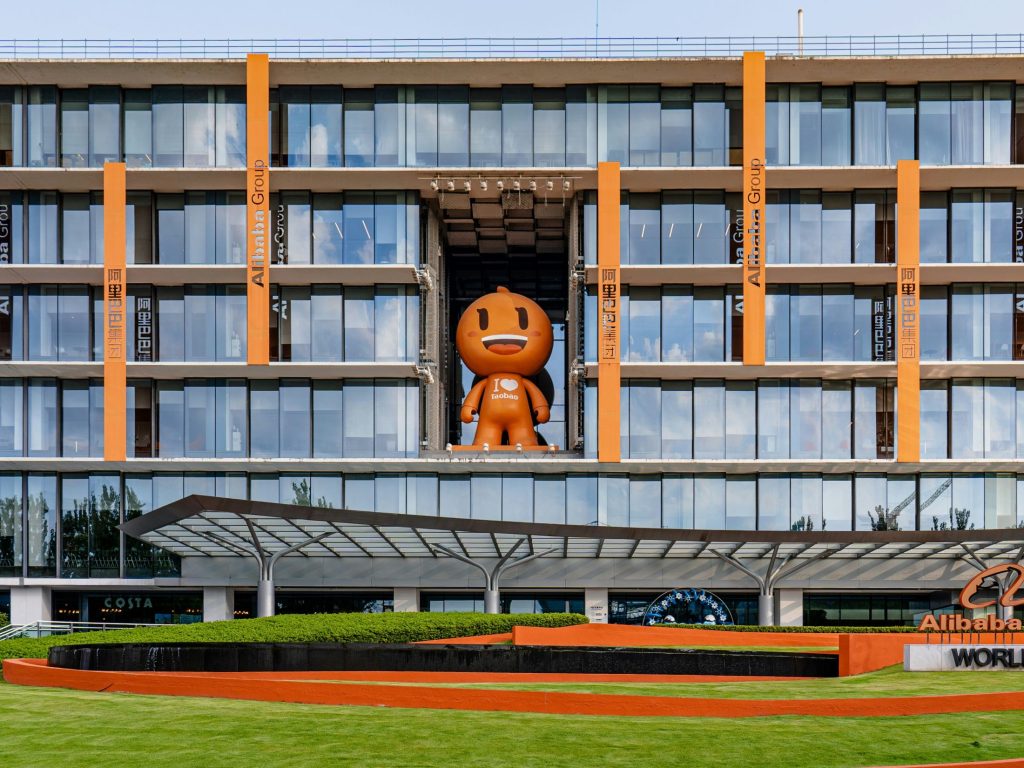 Alibaba mascot as the release of Alibaba's latest Qwen model challenges proprietary AI model economics with comparable performance on commodity hardware.