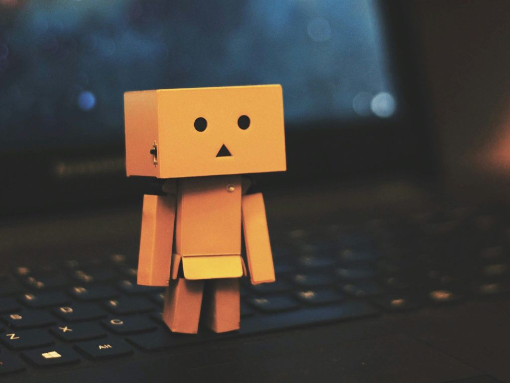 Amazon cardboard bot on a laptop as, according to AWS at this week’s re:Invent 2025, the chatbot hype cycle is effectively dead, with frontier AI agents taking their place.