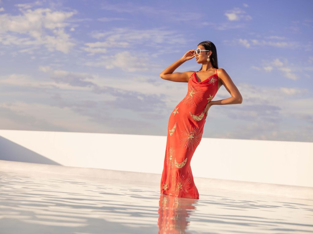 Fashionable woman as Debenhams is piloting agentic AI commerce via PayPal integration to reduce mobile friction and help solve a familiar problem for retailers.