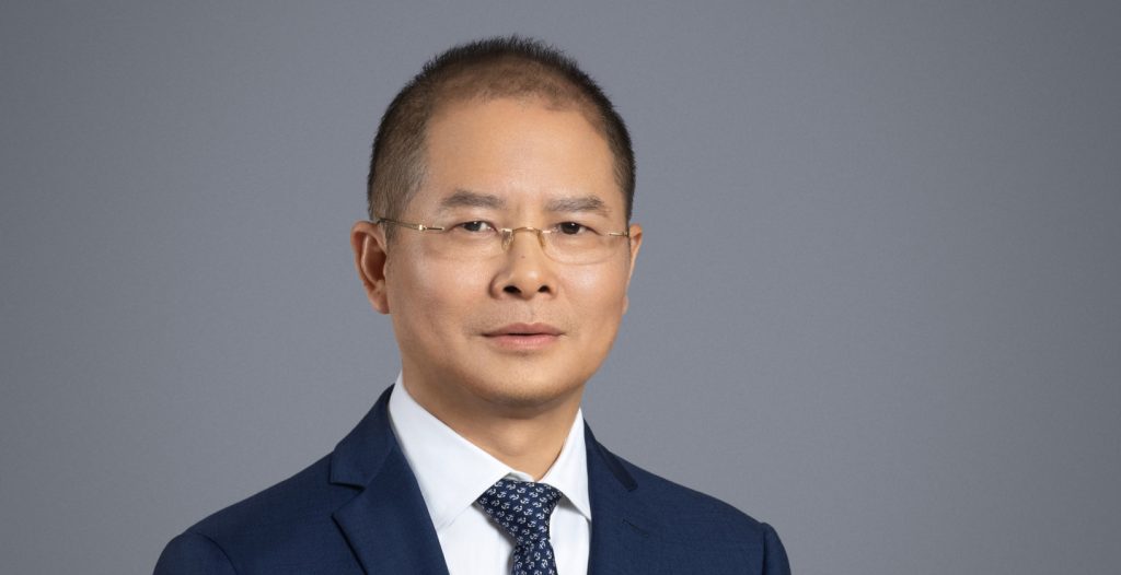 Article illustration of Eric Xu of Huawei. Article concerns new Ascend chip range from the company.