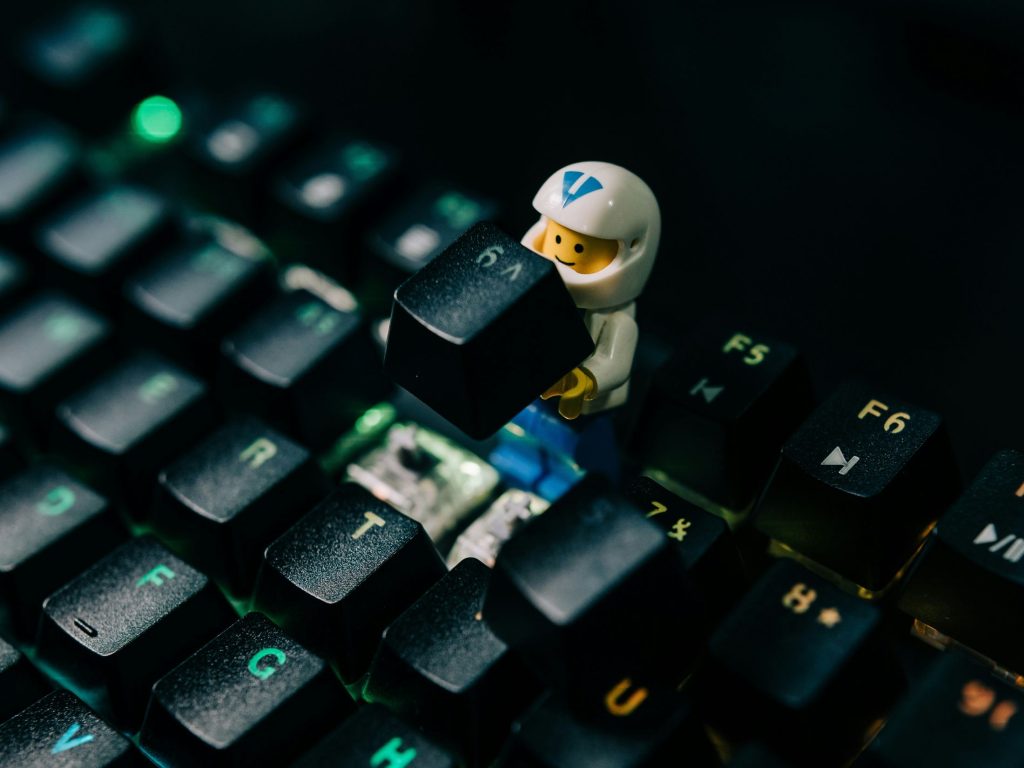 Figure repairing a keyboard as Microsoft believes it has a fix for AI prompts being given, the response missing the mark, and the cycle repeating.